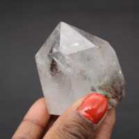 Quartz crystal prism with inclusion